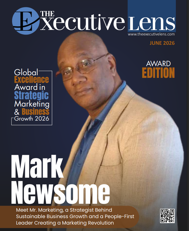 A screenshot of mark newsome. Standing in front of the fireplace.