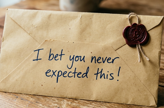 An image of a sealed envelope on a desk