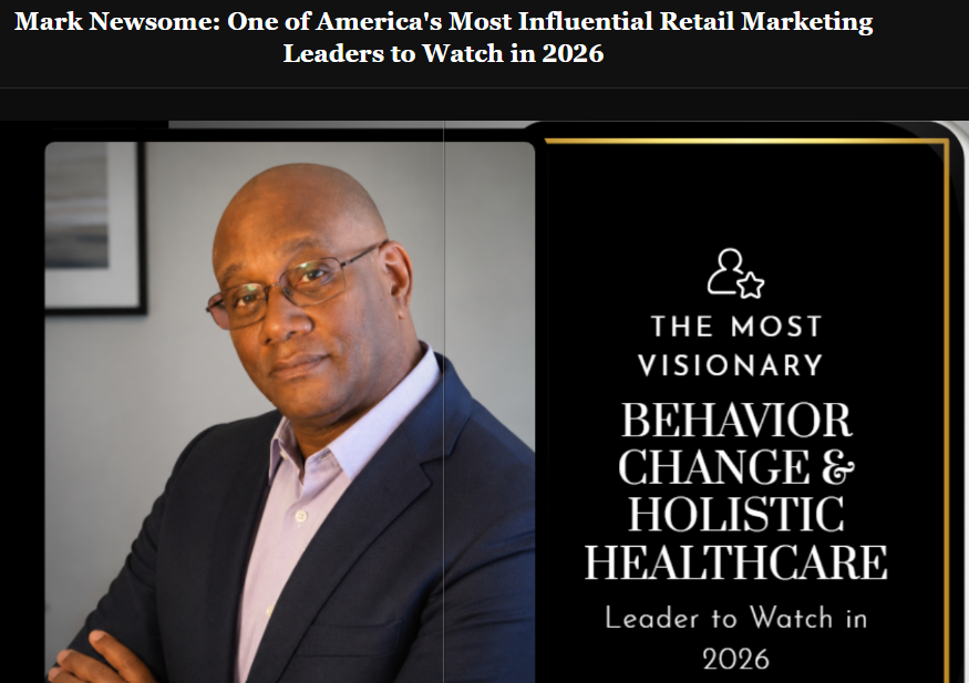A screenshot image of Mark Newsome. aka Mr. Marketing. Sitting a chair. With a blue blazer on.